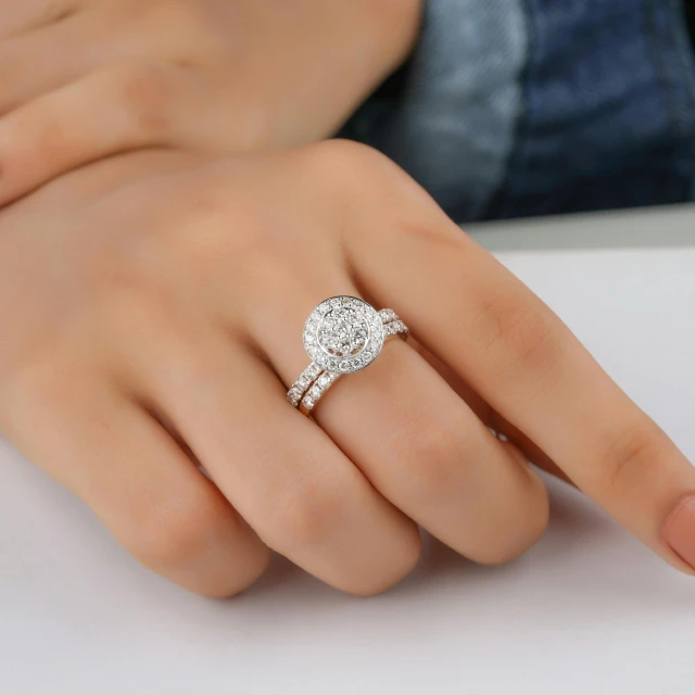 a woman's hand with a diamond engagement ring, inspired by L. A. Ring, romanticism, thick set features, ring of fire, highlights, round