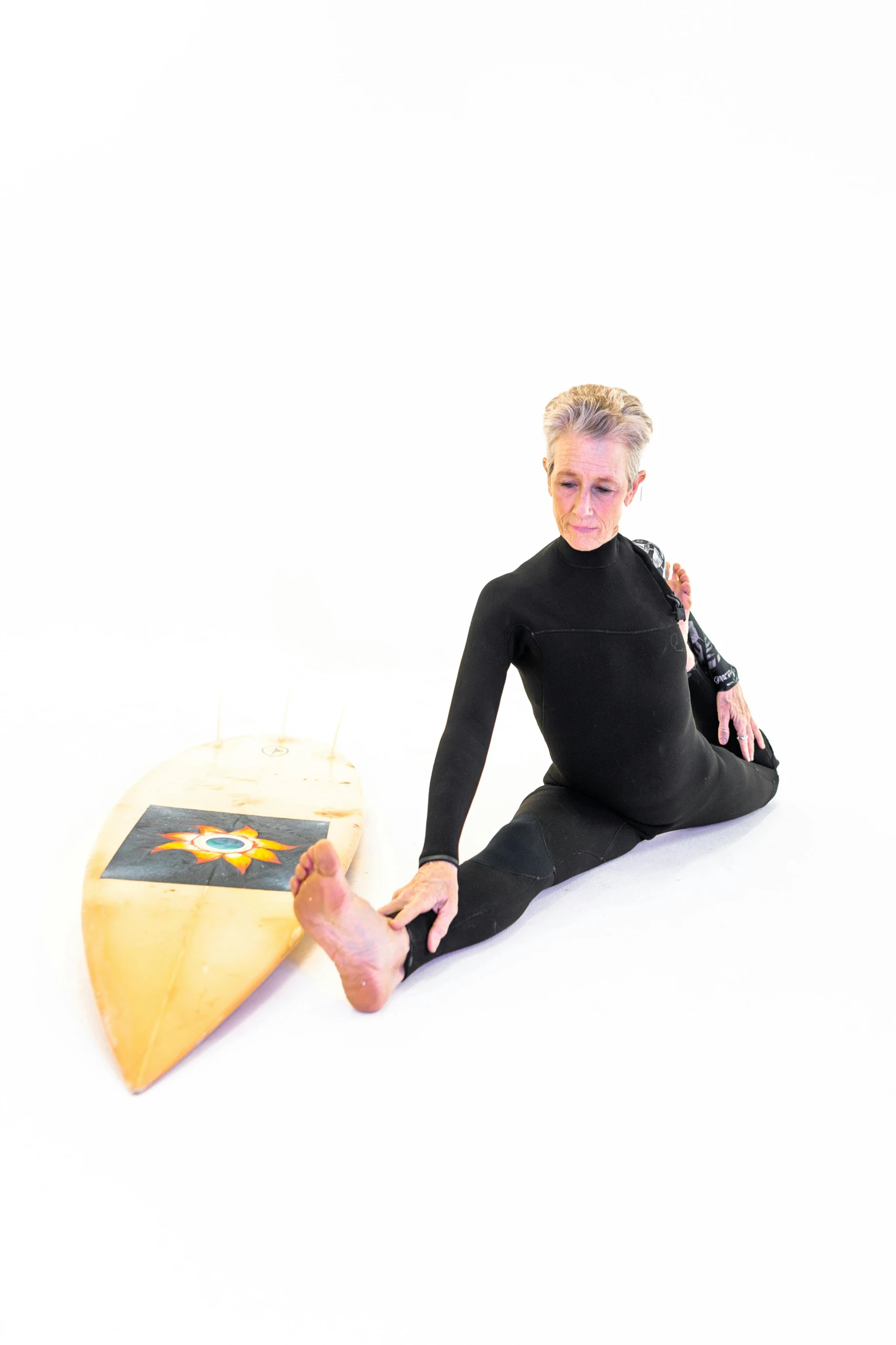 a woman sitting on the ground with a surfboard, by Alison Watt, in spandex suit, white background, lynn skordal, leotard and leg warmers