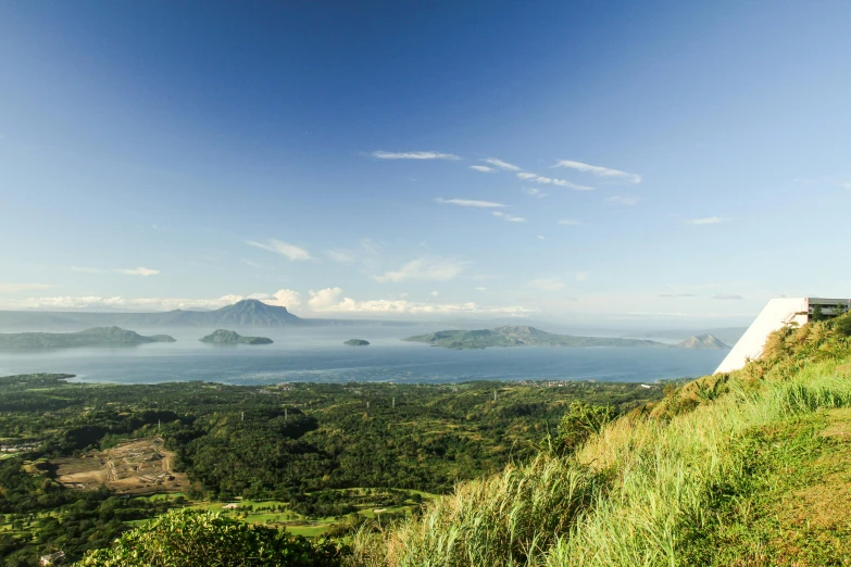 the landscape view shows mountains, hills and water