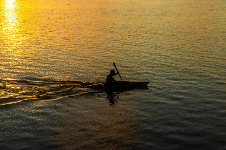 a person in a boat on a body of water, by Jan Tengnagel, pexels contest winner, hurufiyya, evening sunlight, paddle of water, thumbnail, 8k octan photo