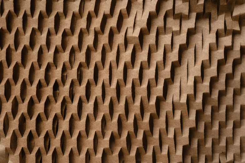 a close up of a wall made of bricks, an abstract sculpture, by Carey Morris, trending on unsplash, generative art, mechanically enhanced honeycomb, brown paper, tech pattern, curves