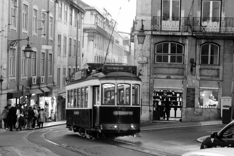 a black and white photo of a trolley on a city street, by Nadir Afonso, renaissance, a beautiful, bay, 2 0 0 2 photo, tourist destination