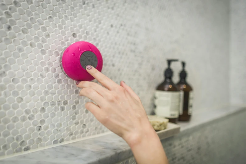 a person using a shower head in a bathroom, by Jacqui Morgan, tachisme, magenta and gray, orb, product view, raspberry