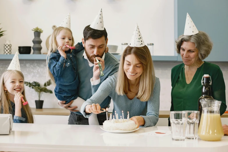 a family celebrating a birthday with a cake, pexels contest winner, private press, wearing a grey wizard hat, people enjoying the show, profile image, thumbnail