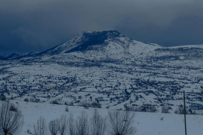 the mountains are covered in snow near each other