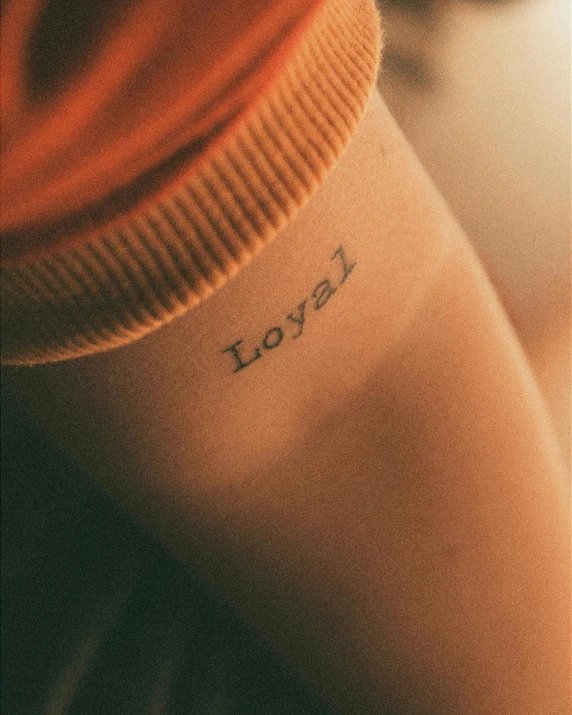 a close up of a person with a tattoo on their arm, inspired by Elsa Bleda, trending on pexels, loyal, a labeled, pride month, full body picture