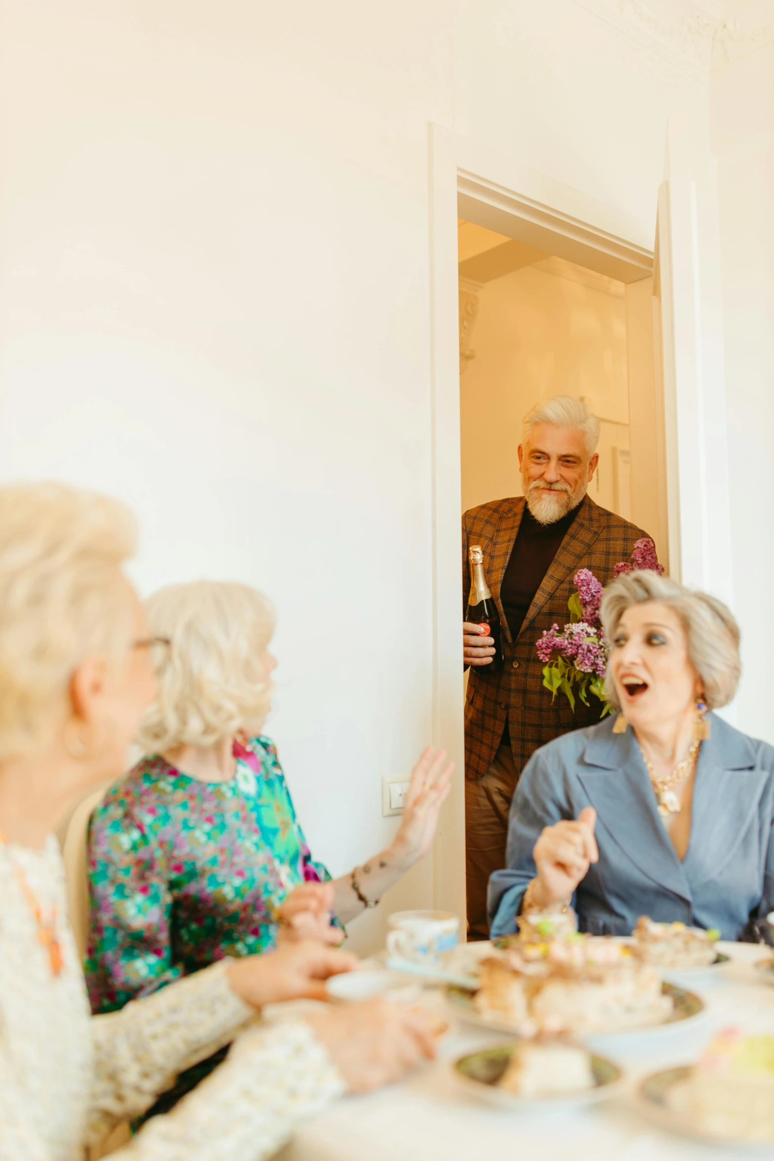 a group of people sitting around a table, old lady screaming and laughing, leaving a room, holiday season, profile image