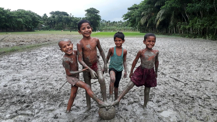 a group of children playing with a soccer ball, an album cover, pexels contest winner, hurufiyya, new guinea mud man, assamese, youtube thumbnail, wet clay