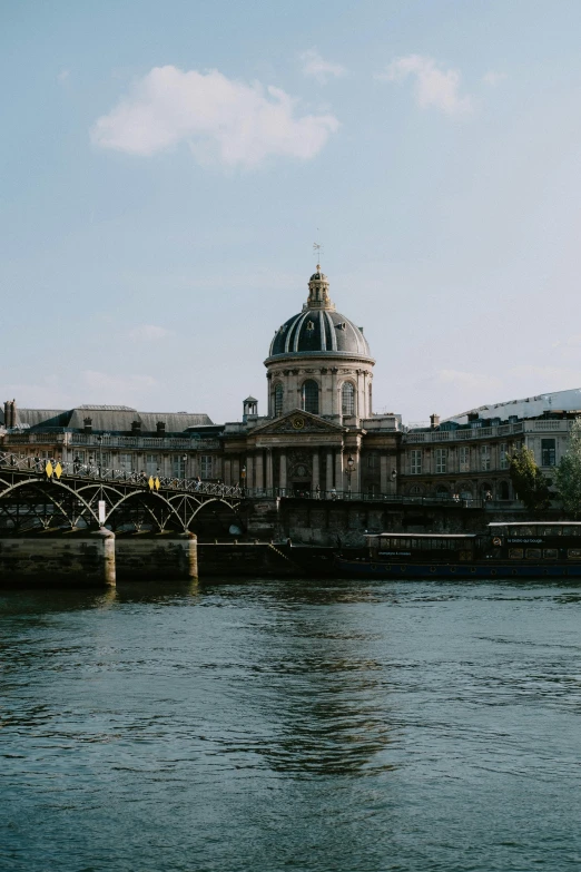 a bridge over a body of water with a building in the background, a photo, paris school, with great domes and arches, cinematic, slide show, multiple stories