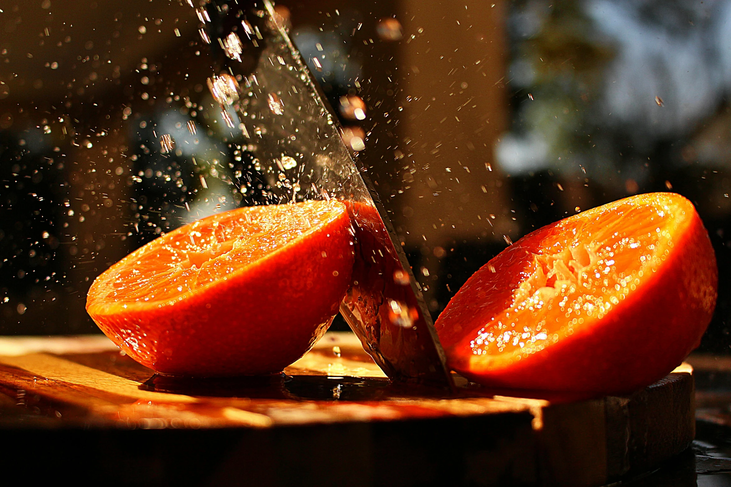 an orange being sliced with a knife on a cutting board, by Niko Henrichon, pexels contest winner, splashing water, on a hot australian day, thumbnail, peaches