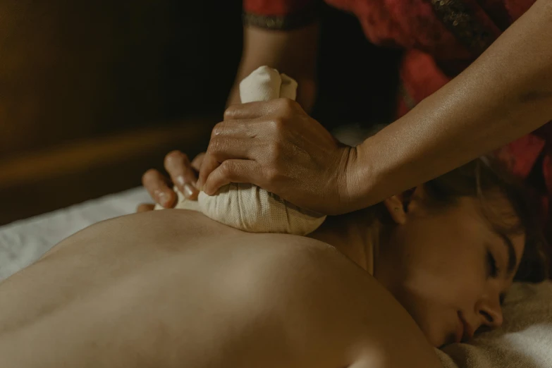 a woman getting a back massage at a spa, a sketch, unsplash, fisting monk, shot from cinematic, boys, soft and detailed
