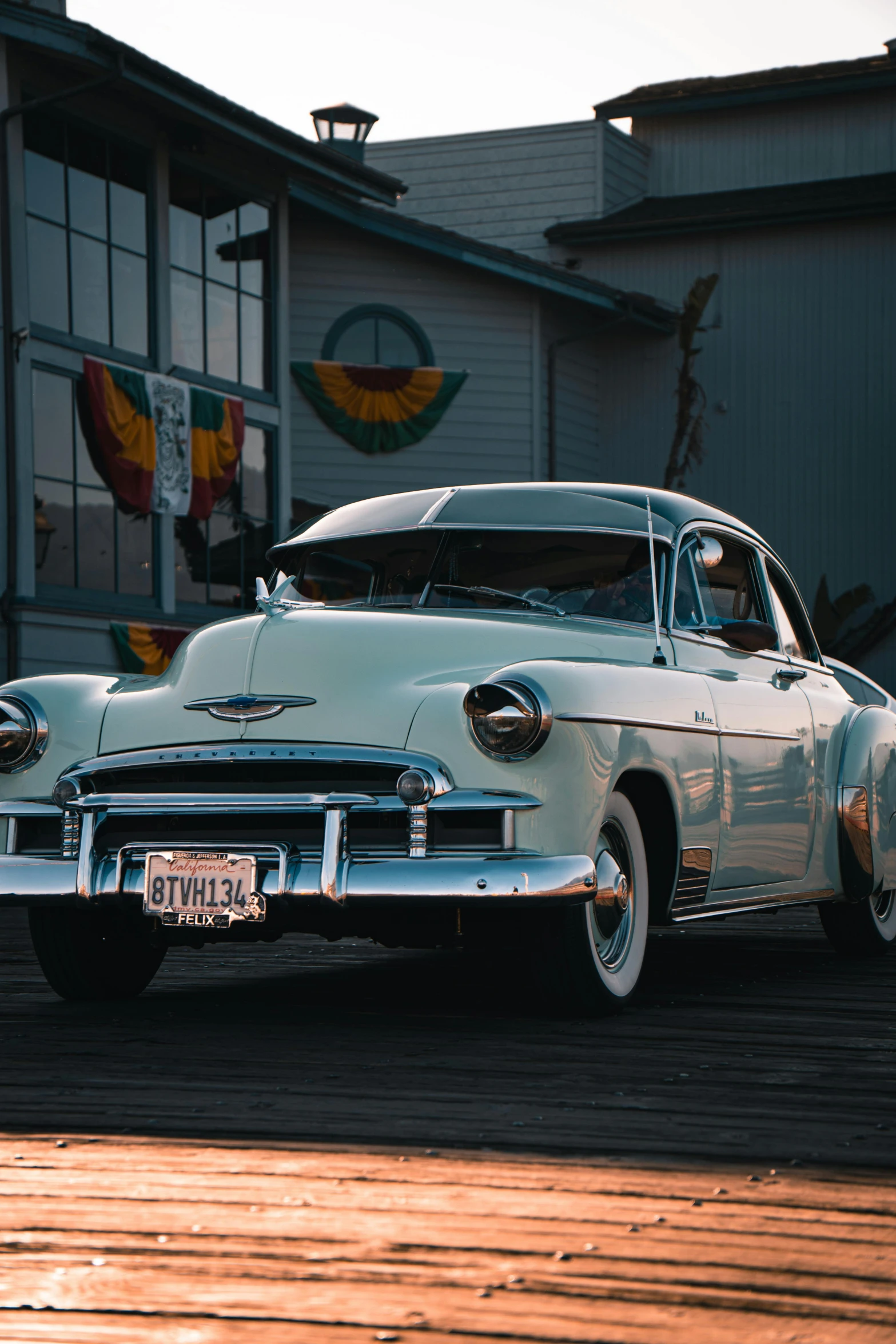 a white car parked on the side of the street