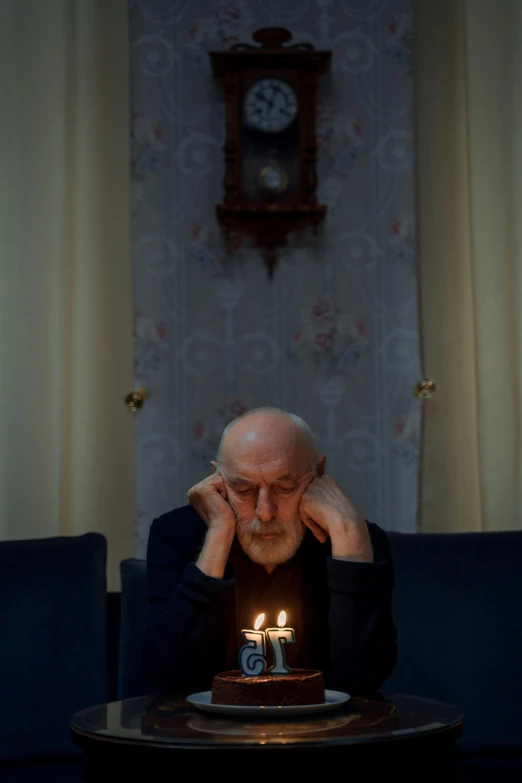 a man sitting in front of a cake with lit candles, by Ihor Podolchak, dementia, on a candle holder, mike ehrmantraut, she's sad