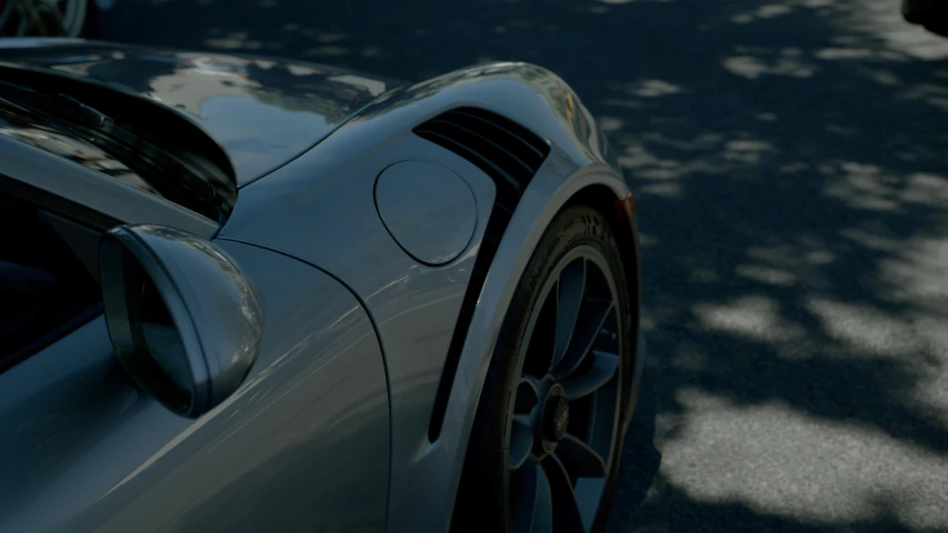 a close up view of the rear end of a sports car