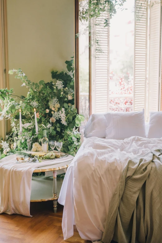 an assortment of flowers arranged in a bedroom setting