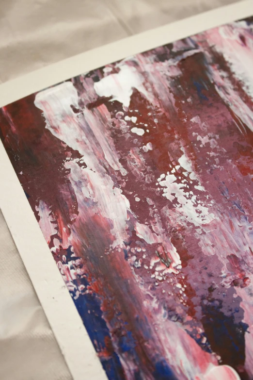 a close up of a painting on a sheet of paper, inspired by Richter, unsplash, red and purple palette, prints, atmospheric artwork, printed page