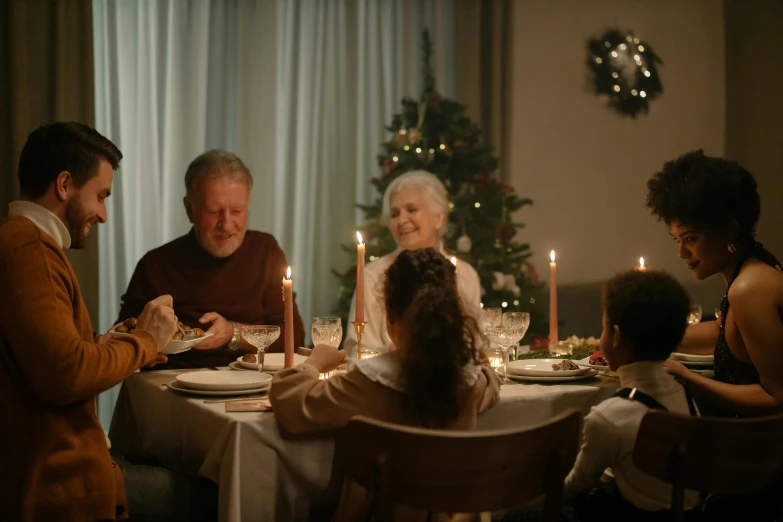 a group of people sitting around a dinner table, christmas, profile image, cinematic image