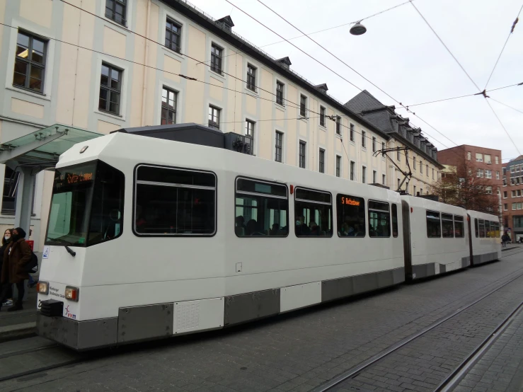 an image of an old train moving down the street