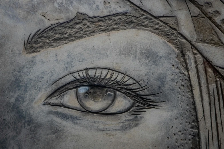 a close up of a statue of a woman's eye, concrete art, etched relief, made of cement and concrete, detailed digital artwork, street art 8 k