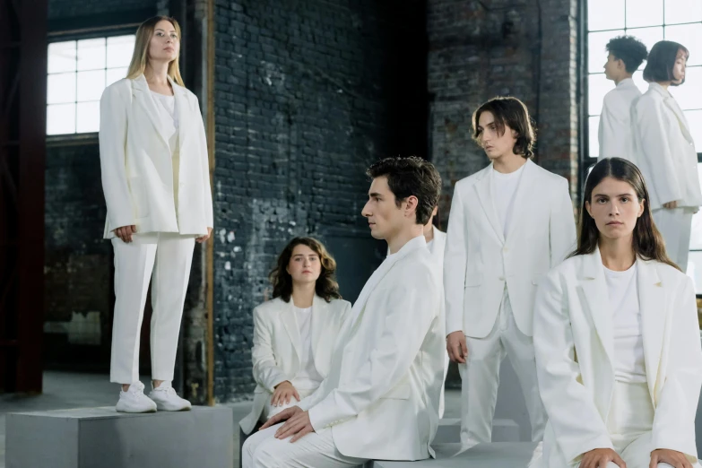 a group of people in white suits posing for a picture, inspired by Vanessa Beecroft, antipodeans, timothee chalamet, official store photo, family portrait, looking off to the side