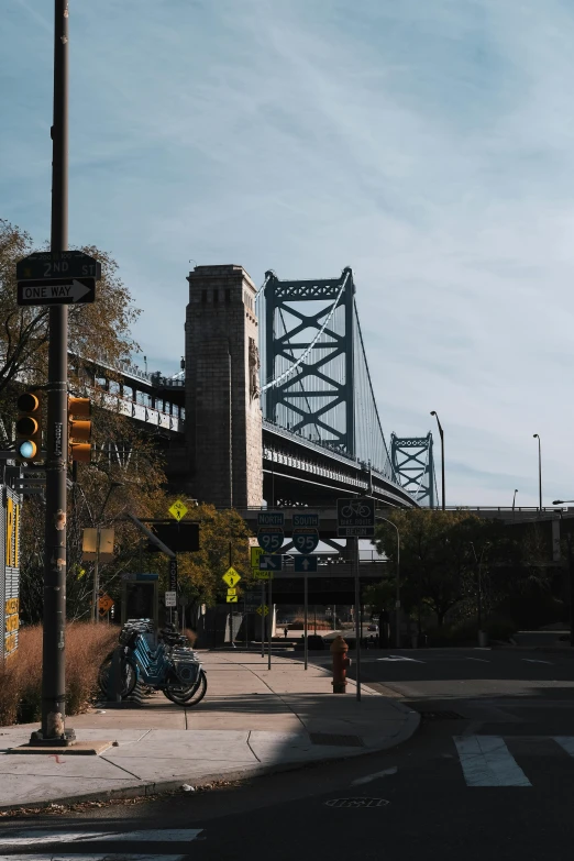 a city street with a bridge in the background, new jersey, taken in 2 0 2 0, fan favorite, tall structures