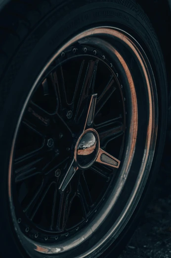 a close up of a tire on a car, a picture, pexels contest winner, retro dark vintage, 15081959 21121991 01012000 4k, black color scheme, instagram story