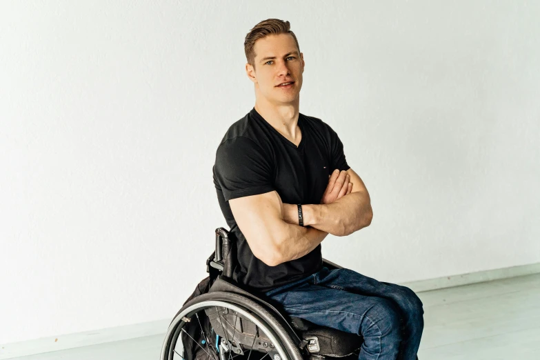 a man in a wheelchair looking forward