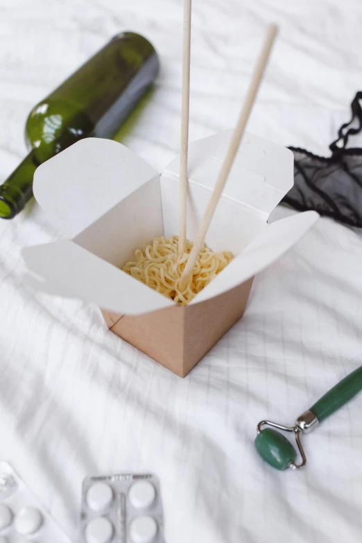 a box of noodles with chopsticks and a bottle of wine, inspired by Tan Ting-pho, square, premium, paper, free