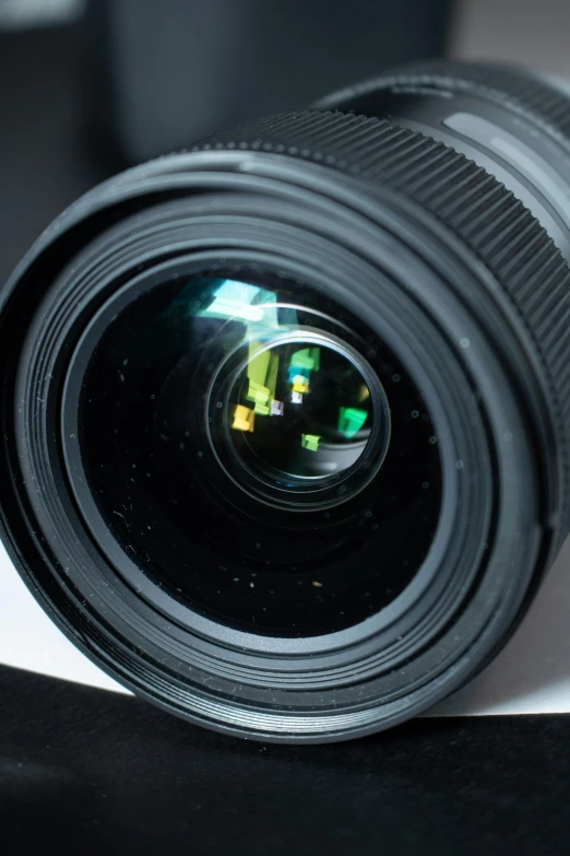 a close up of a camera lens on a table, a macro photograph, by Greg Rutkowski, photorealism, wide angle lens. 8 k, with laser-like focus, shallow depth of fielf