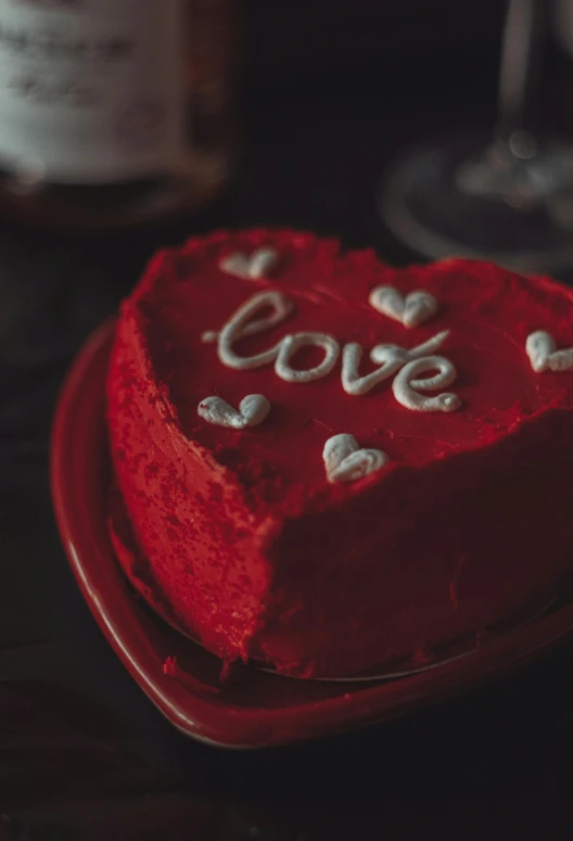 a red heart shaped cake sitting on top of a red plate, a picture, pexels, engraved, love moive, prettt, lush