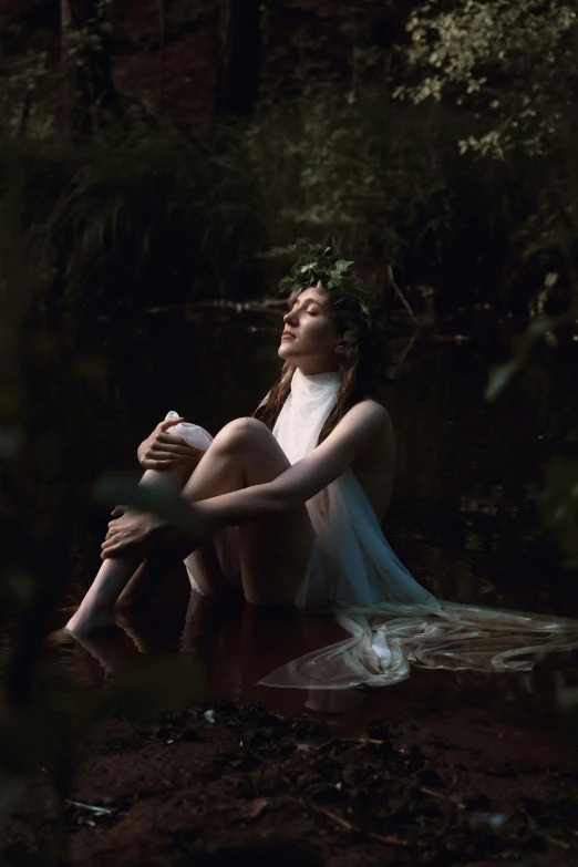 a woman sitting on a log in the woods, inspired by Elsa Bleda, renaissance, nymph in the water, contest winner 2021, pale glowing skin, unsplash photo contest winner