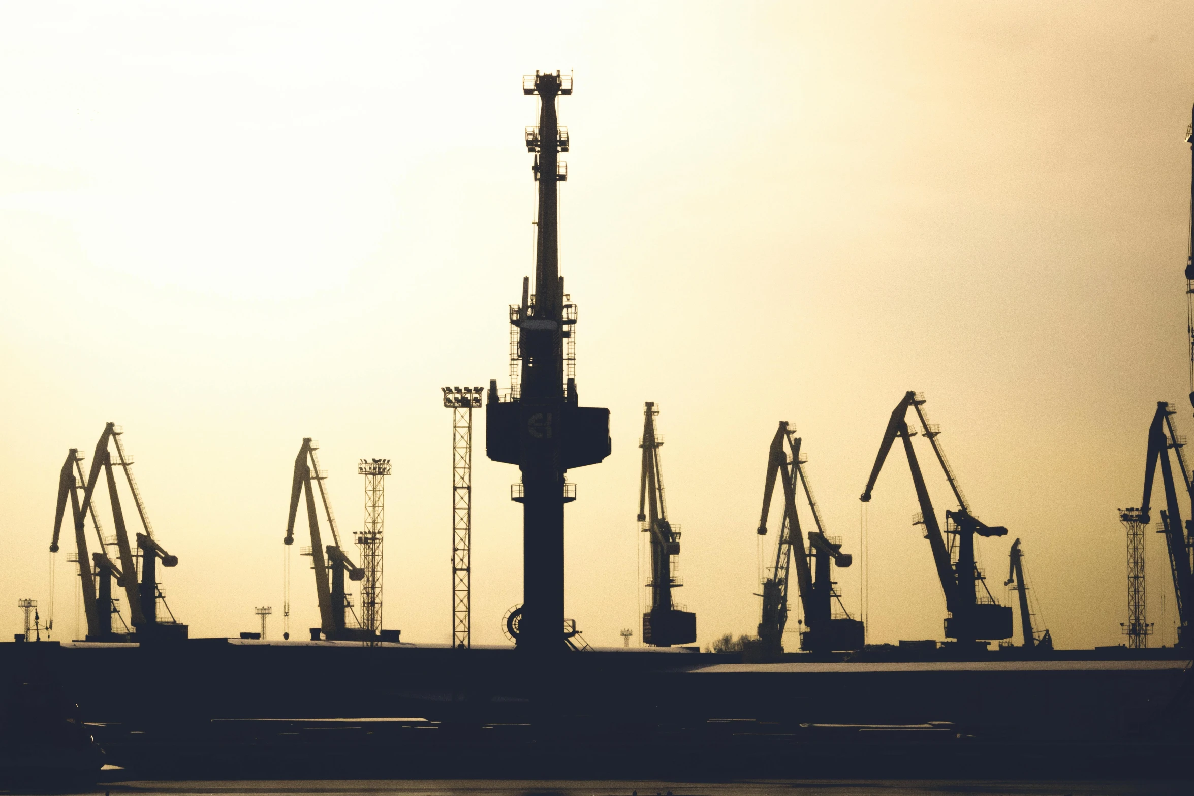 a black and white photo of cranes in a harbor, a cartoon, pexels contest winner, figuration libre, industrial colours, plain background, profile image, various sizes