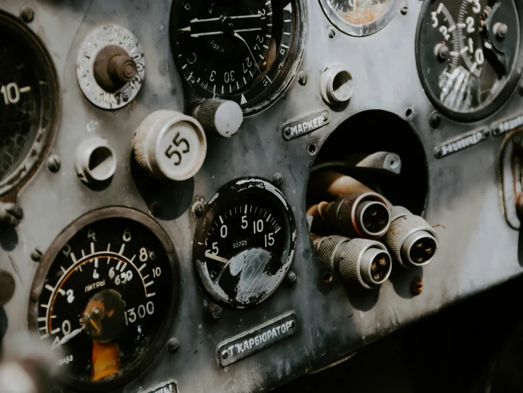 a close up of a bunch of gauges on a plane, by Emma Andijewska, trending on unsplash, visual art, vintage car, background image, historical photo