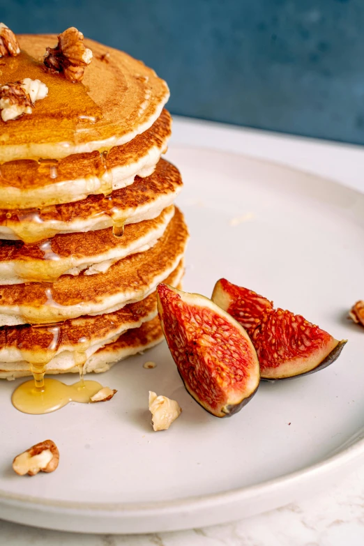 there is a very large stack of pancakes on a plate