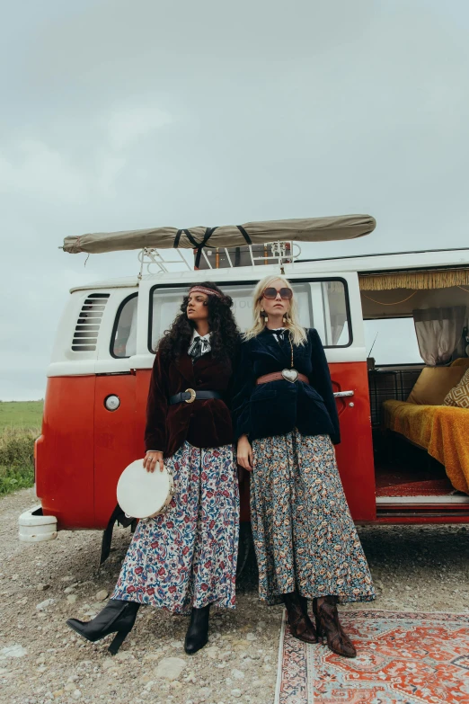 a couple of women standing next to a van, trending on unsplash, kitsch movement, bohemian fashion, conde nast traveler photo, instagram story, prairie