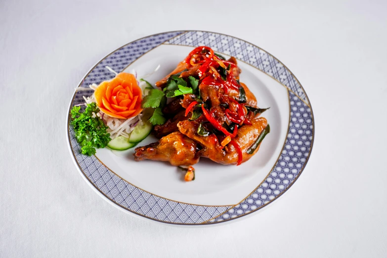 a white plate topped with meat and veggies, inspired by Li Kan, unsplash, hurufiyya, black lion with peacock wings, spicy, 35 mm product photo”, cloisonne