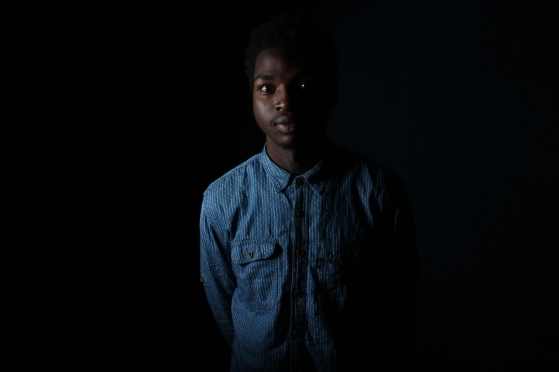 a woman in dark room with dark lighting