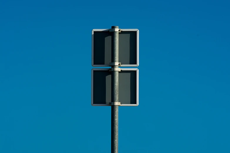 two road signs showing one way to go and the other to stop