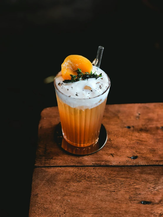 a drink sitting on top of a wooden table, a portrait, unsplash, (light orange mist), server, slush)), trending photo