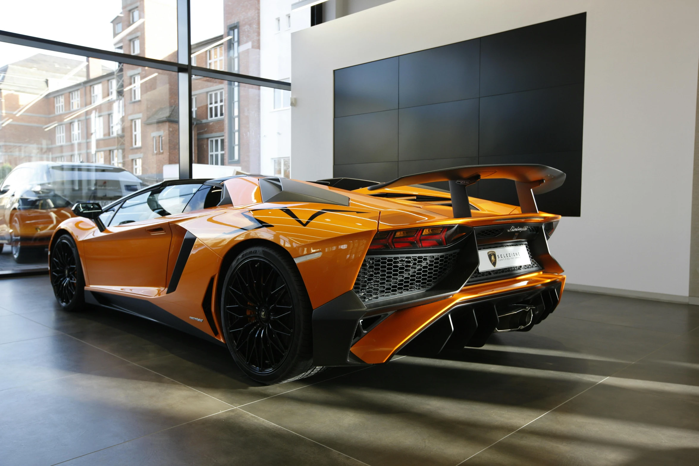 a sports car is parked in a large building