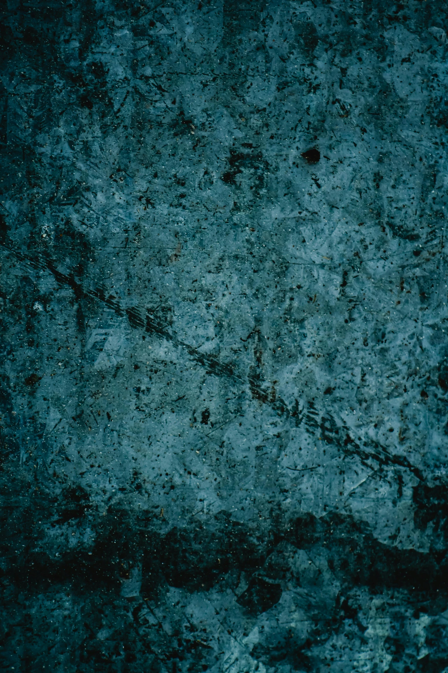 an abstract background with dirt, cement, and small black dots