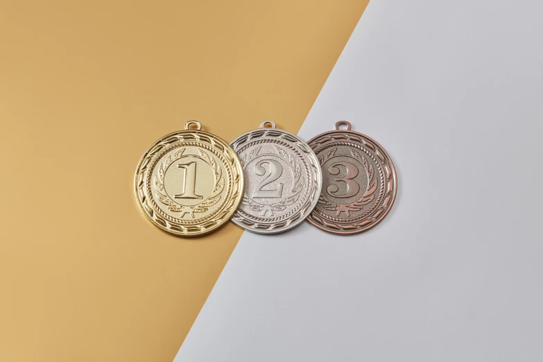 three gold, silver and bronze medals on a yellow and white background, an engraving, trending on unsplash, ultra detailed wire decoration, 84mm), 3 - piece, copper