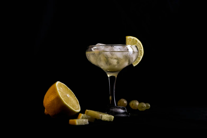 a cocktail sitting on top of a table next to a slice of lemon, a still life, by Ndoc Martini, pexels contest winner, renaissance, white moon and black background, ((still life)), with sparkling gems on top, adult