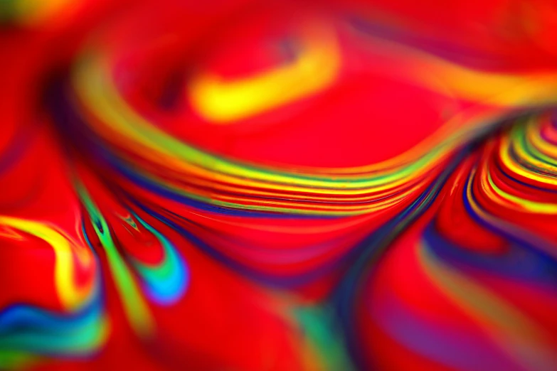 a close up of a colorful swirl on a red background, a raytraced image, pexels, holographic plastic, tilt blur, ((raytracing)), vhs colour photography