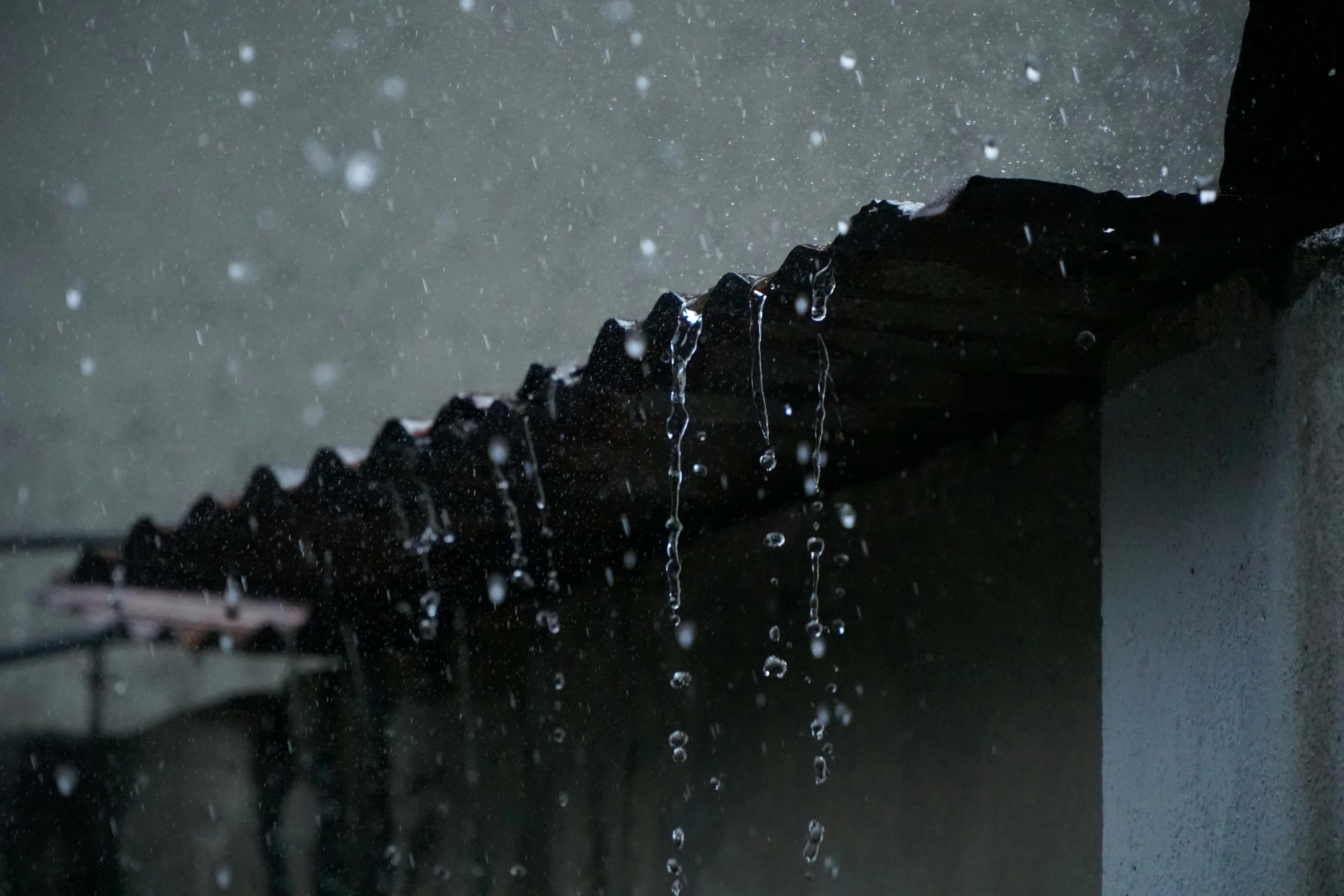 a person holding an umbrella in the rain, water running down the walls, shed roof, promo image, dripping black and grey paint