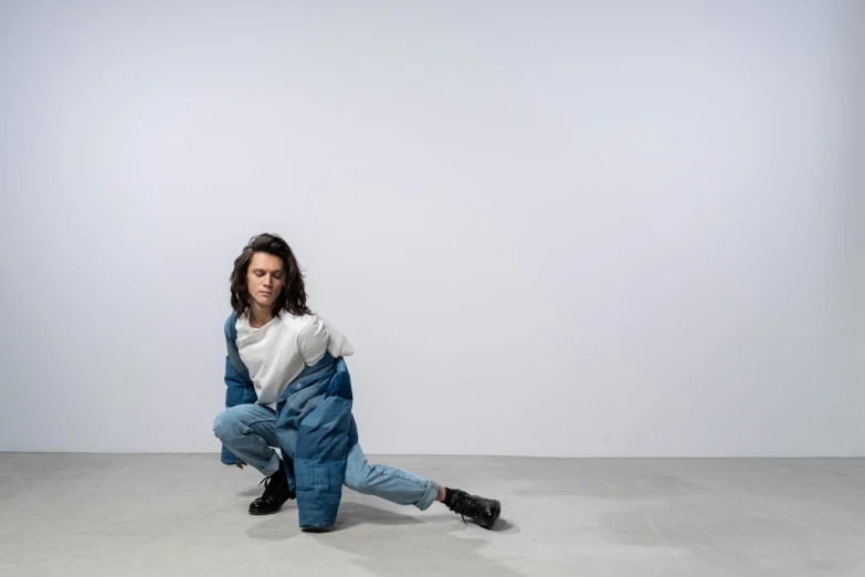 a woman is posing in an all denim outfit