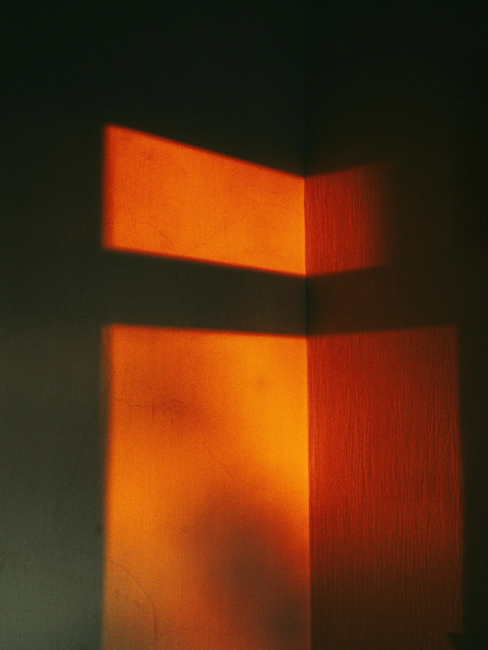 a close up of a light coming through a window, by Attila Meszlenyi, orange color, smooth shadows, corners, taken in the late 2000s