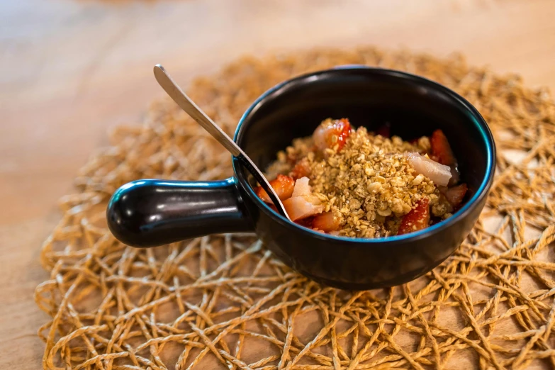 a bowl of food sitting on top of a table, spoon placed, dessert, botanicals, crisp and sharp