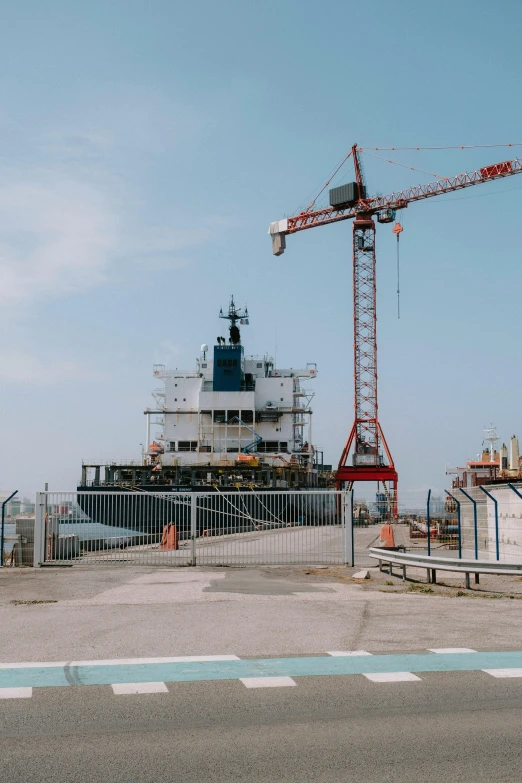 a large boat sitting on top of a body of water, unsplash, constructivism, construction yard, 1999 photograph, maritime, tallinn