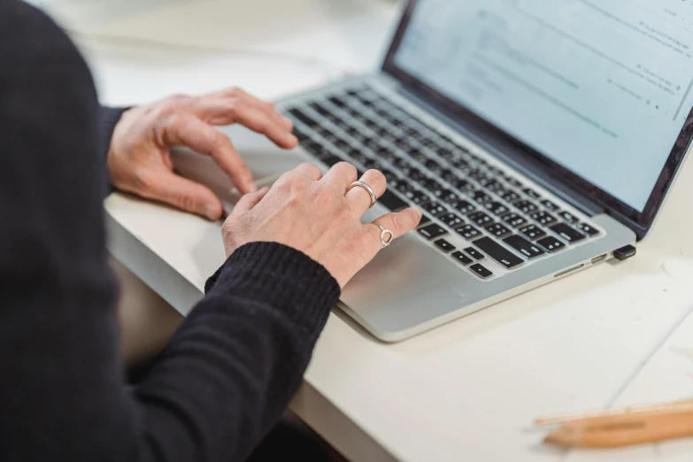 a close up of a person typing on a laptop, by Carey Morris, trending on pexels, avatar image, lachlan bailey, bottom angle, email